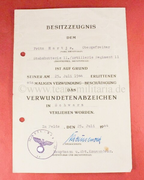 Besitzzeugnis zum Verwundetenabzeichen in Schwarz  Obergefreiter Fritz Hartje aus dem Artillerie Regiment 11